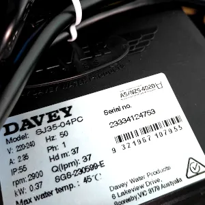 An adhesive labelling of Standards Australia and Standards New Zealand found on Davey's Garden System electropump, signalling that it's met regulatory benchmarks to garner home support. A logo of a Kangoroo is seen, portraying that this water pump is completely made in Australia alongside all the electrical data stated. The barcode and serial number for verification is also mentioned for future references.
